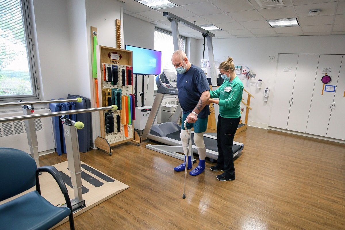 Adult on exercise equipment at Vanderbilt Rehabilitation Center