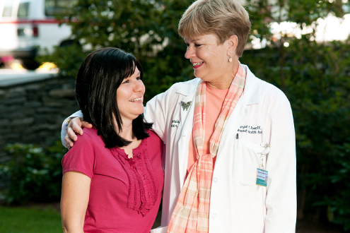 A Lifespan nurse navigator with a patient.