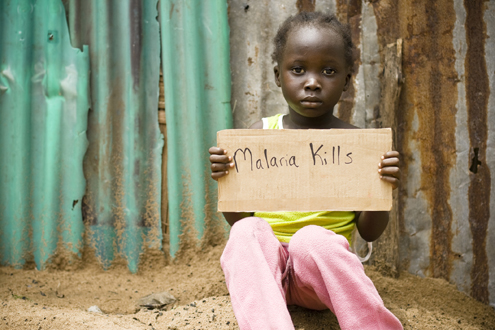 Child holding malaria sign