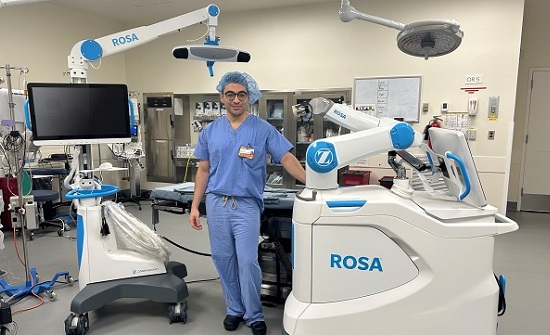 Mouhanad El Othmani, MD, with the ROSA robot at Newport Hospital.