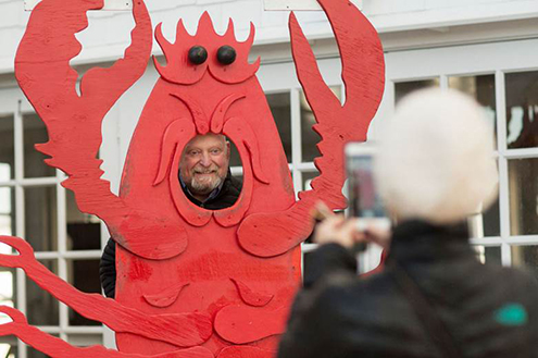 Walter Kalisz posing for a photo as a lobster.