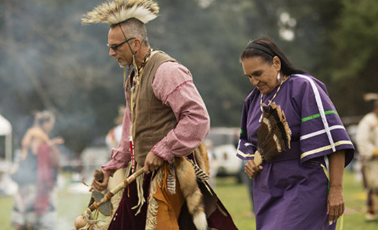 Carole participating in a Native American dance.