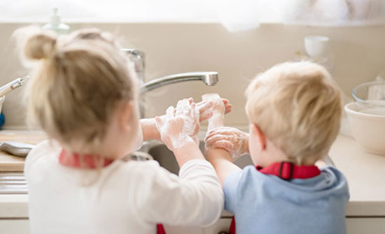 Children washing their hands