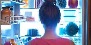 Women standing at refrigerator