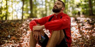 Man in woods relaxed
