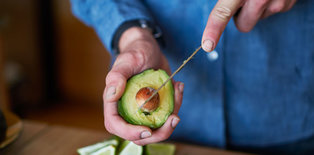 Man cutting avocado