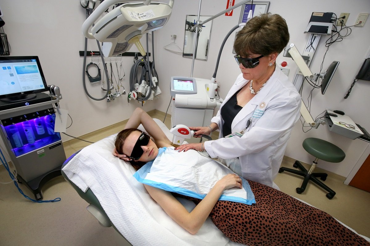 An aesthetic surgery patient and doctor wearing protective eyewear 